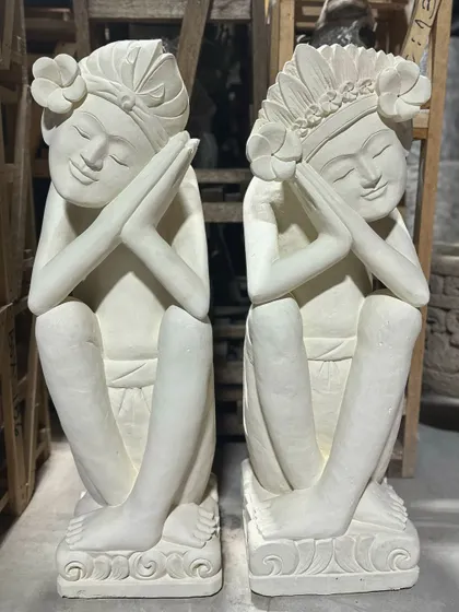A pair of our serene sandstone dolls. With their peaceful expressions and hands held in prayer, they are a beautiful representation of Balinese grace and tranquility.