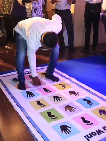 The mat game is a hit with all ages! Here's a guest giving it his best shot.