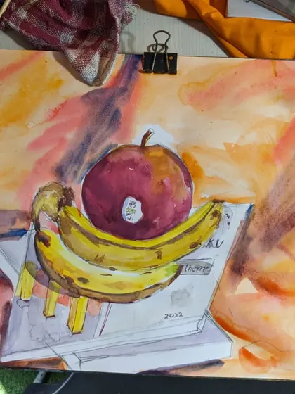 A vibrant watercolor still life of fruit on a book. This exercise focuses on capturing bright colors, soft textures, and the interplay of light on different surfaces.