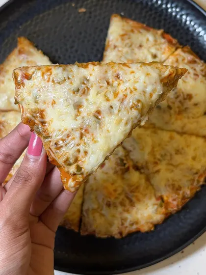 A slice of my Melting Cheese Pizza, showing the perfectly melted cheese and crispy crust.