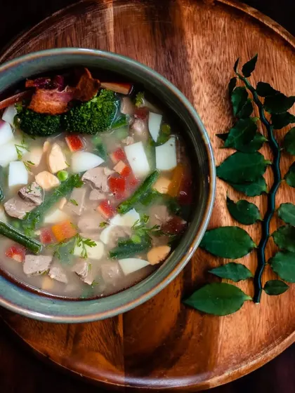 My special Paaya soup is slow-cooked overnight to create a rich, gelatinous bone broth. I load it with fresh vegetables, tender meat, and liver, making it an incredibly nutritious and comforting meal, especially for older dogs or those needing extra hydration.