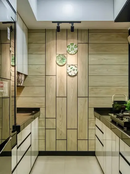Another angle of the Lodha Park kitchen, showing the beautiful interplay of wood, glass, and light.
