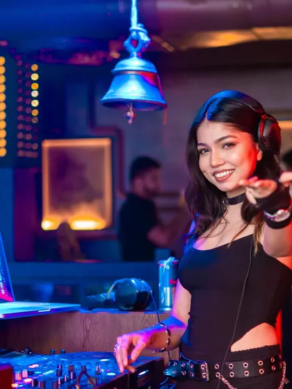 My goal is to connect with every person on the dance floor. This shot captures me interacting with the crowd, inviting everyone to join the party and feel the music.