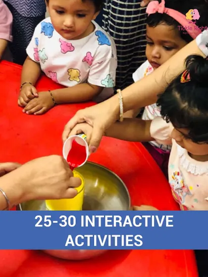 Tiny hands get messy in a sensory activity, pouring colored liquid. Sensory play is vital for brain development, helping children understand the world through touch, sight, and sound.