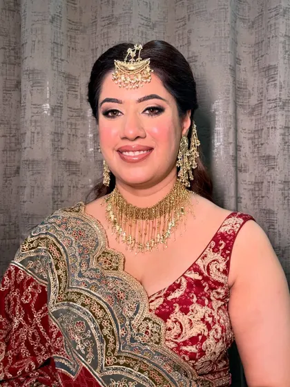 Samiksha, looking beautiful for her brother’s wedding. The makeup is classic and elegant, with a focus on her eyes.