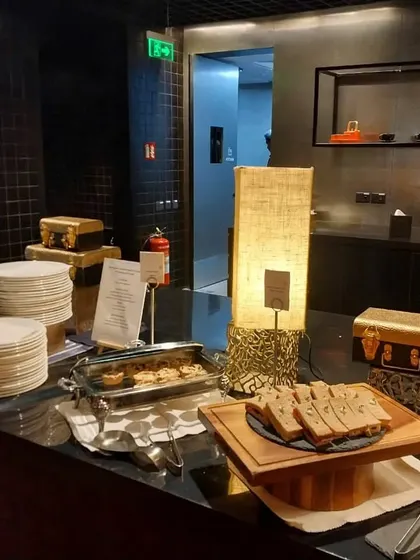 A clean and organized buffet station ready for service at a Spotify corporate event. We focus on both the quality of the food and the overall aesthetic of the dining experience.