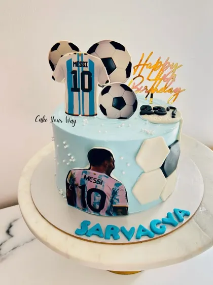 When the game gets tough, the cake gets sweeter. A Messi-themed football cake for a true fan.