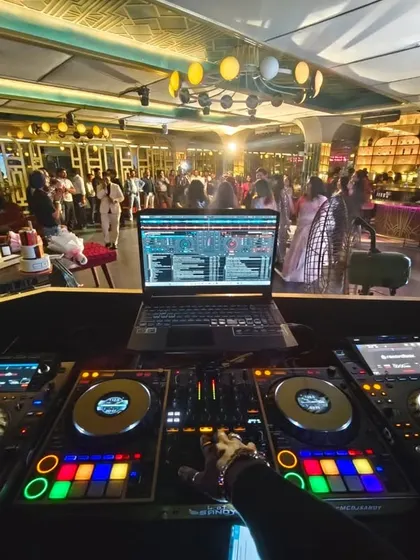 My view from the DJ console at the Gatsby for a book launch and Founder's Day party. The vibe was electric as I played a mix of Bollywood, English, and South Indian tracks.