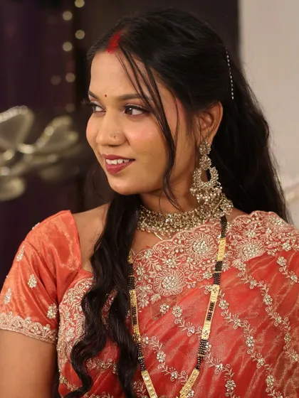 A beautiful side profile of the bride. Her makeup is expertly blended to look seamless and natural from every angle.