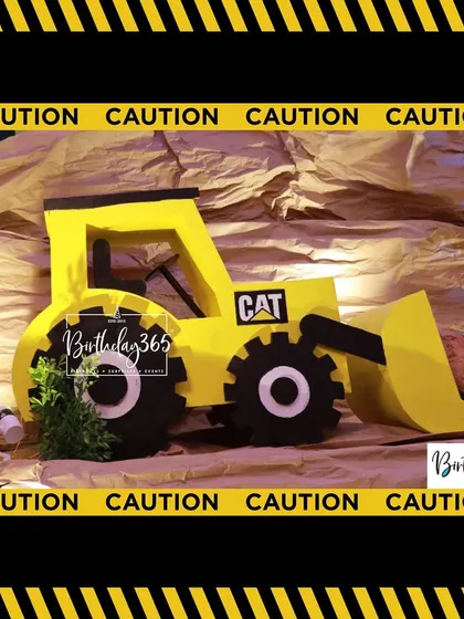 A close-up of the CAT bulldozer prop from our construction theme, set against a realistic rock backdrop.
