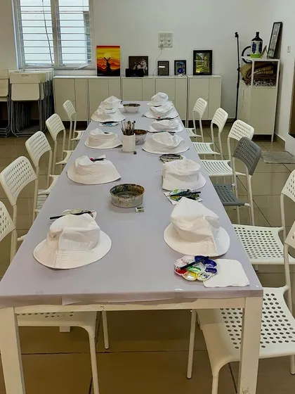 A clean and bright setup for a kids' art party, showing the versatility of our furniture and space.