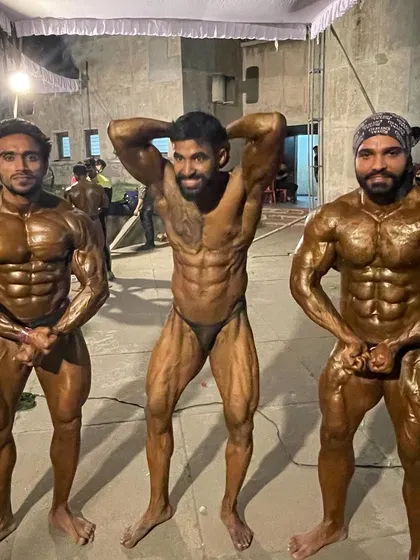 Backstage with the team, everyone tanned and ready to compete.