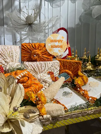 The bandhani-wrapped gifts are the star of this Rakhi platter. The textures and colors are so vibrant and festive.