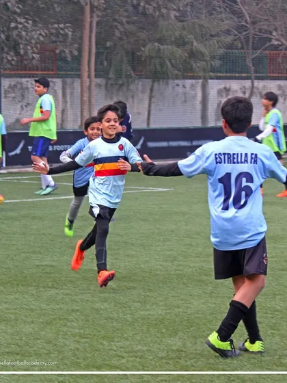 A player celebrating with open arms after a successful play. These moments of individual success contribute to the team's overall morale and confidence.