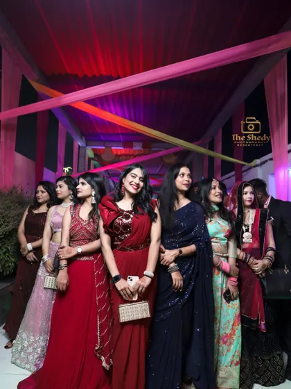 The bride's squad! A beautiful group photo of the bridesmaids and friends, all dressed up for the wedding festivities.