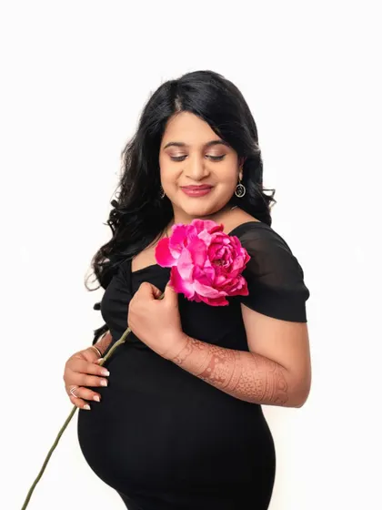 A serene and beautiful shot. The focus is entirely on the mother-to-be and the life she is creating.