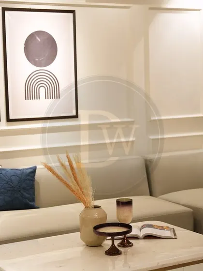 A close-up of the U-shaped sectional from a recent project. The light, neutral fabric and minimalist design make the room feel open and airy, while the marble-top coffee table adds a touch of modern elegance.