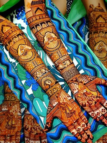 A beautiful full bridal design with intricate patterns and royal motifs covering the arms.