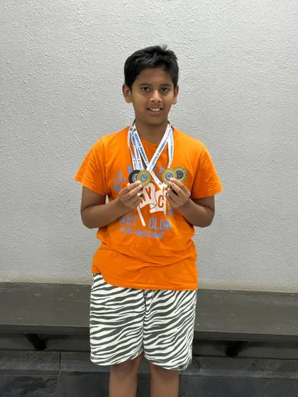 Aryan Sagar Chandra with his impressive medal haul from the interschool competition at Skype Fitness, including two golds for relay events.