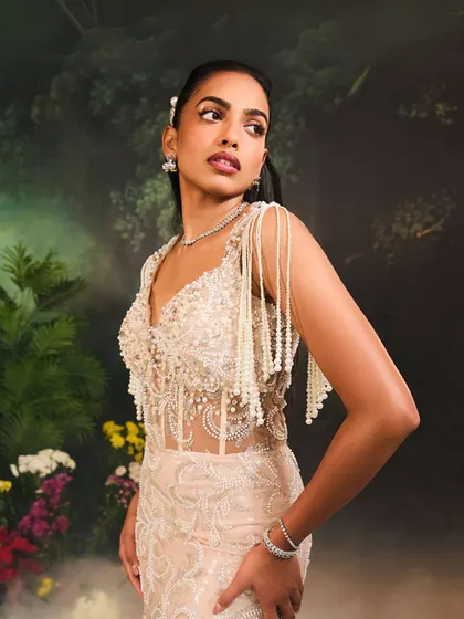 A closer view of the Nuray Gown's bodice, highlighting the intricate pearl work and the sheer corset that defines this captivating piece.