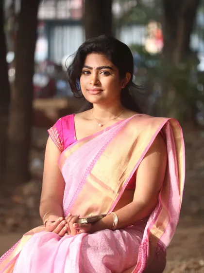 This look shows how I balance natural makeup with traditional attire. The skin is kept fresh and the lips have a natural tint, letting the beauty of the pink saree shine.