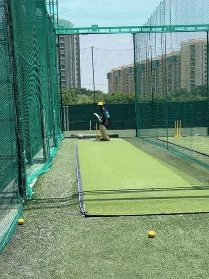 The batsman in the middle of a shot, showing full commitment.