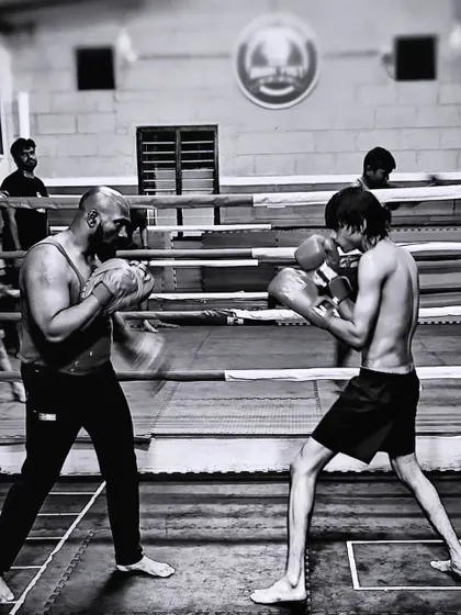 A classic moment from a boxing sparring session. This image captures the focus and intensity required when you're trading punches, reading your opponent, and looking for an opening.