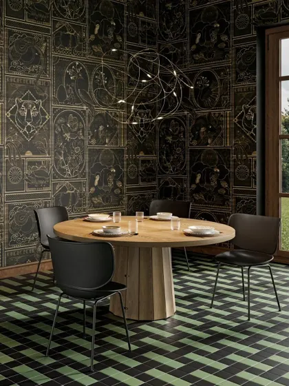 The Flock of Light in a dining setting, where its free-form, artistic shape adds a touch of whimsy and magic to the room.