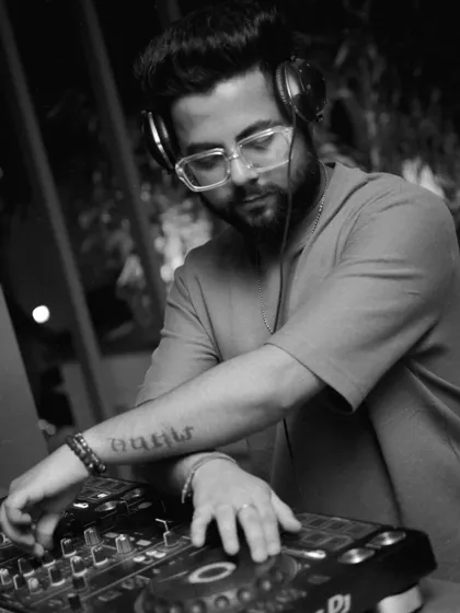A black and white shot capturing my focus while mixing. It's all about the music and the craft.