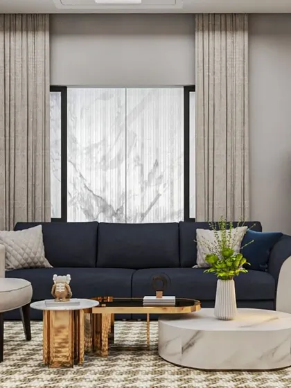A simple and elegant living room concept with a dark blue sofa, marble-topped coffee tables, and neutral-colored armchairs for a balanced look.