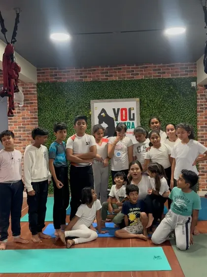 A candid group shot of our kids' class, full of personality and fun.