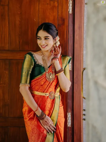 A happy client posing in her traditional attire, her smile is the best compliment.