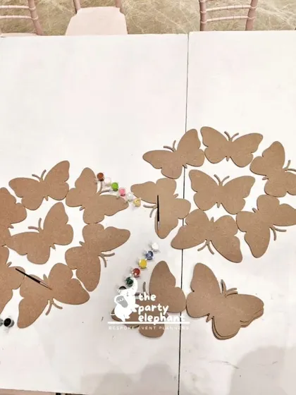 We set up a creative activity station where little guests could paint their own butterfly cutouts. This hands-on craft is a great way to entertain children and let them take home a personalized party favor.