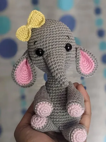Another view of the sweet elephant doll, showing her cute pose.