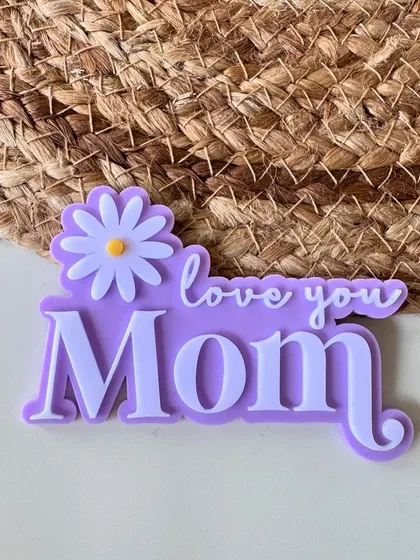 "Love you Mom." This lilac acrylic charm with a daisy is a lovely way to express your affection on Mother's Day.