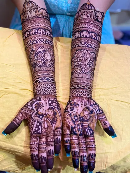 A slightly different angle of the same royal-themed portrait mehandi, showcasing the symmetry and intricate detailing that covers the hands and arms.