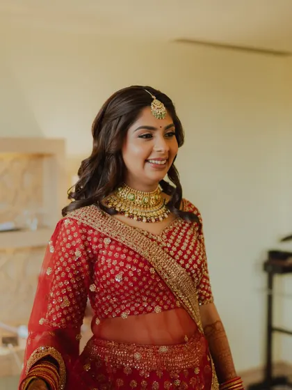 A candid getting ready shot. Her natural smile shines through as we finalize her classic bridal look.