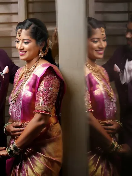 A beautiful reflection shot, capturing both the couple's direct pose and their mirrored image in the darkness.