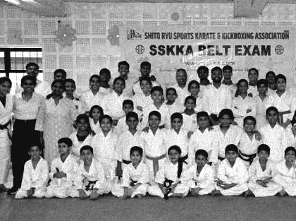 A throwback photo of our SSKKA family after a belt exam. We have a long history of fostering talent and building a strong, supportive community.
