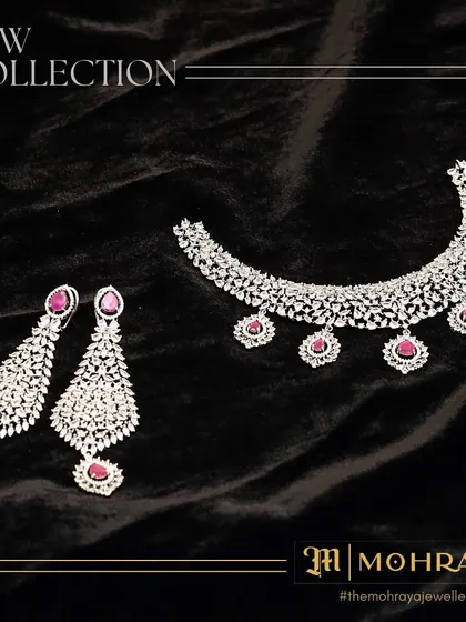 A new addition to our collection. This beautiful ruby and diamond necklace with matching earrings is perfect for a classic, elegant look.
