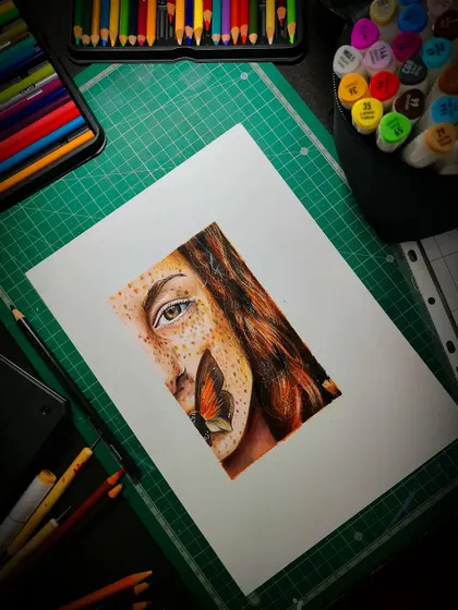 My first attempt at a colored pencil portrait. This piece features a woman with freckles and a butterfly, a great subject for practicing skin texture and delicate details.
