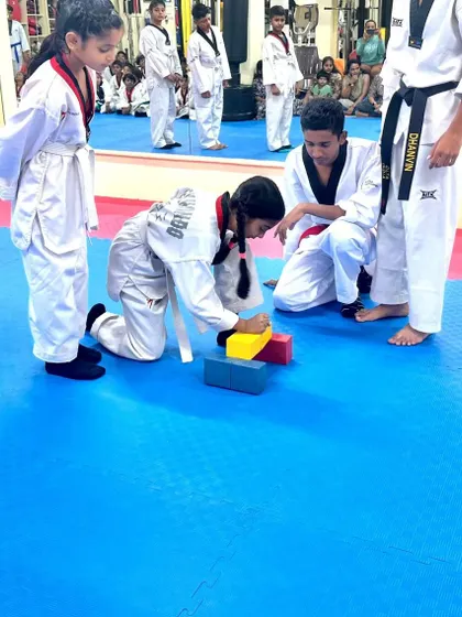 Another student attempts the block-breaking drill.
