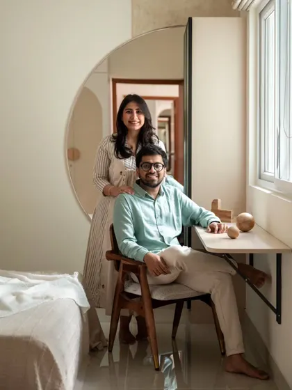 My happy clients in their new guest bedroom, which doubles as a home office. Their satisfaction is the ultimate measure of a project's success.