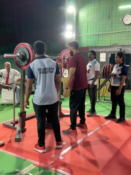 On the platform at the PI National Open. This shot captures the intensity of the competition environment. Even with a serious ankle injury, Khushi showed up ready to perform, a testament to her mental toughness.