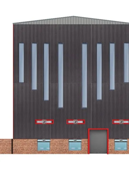 A detailed view of the steel factory's elevation. The design incorporates long vertical windows to allow natural light into the vast industrial space, breaking up the massive scale of the facade and adding a functional design element.