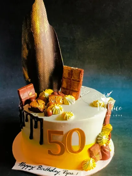 A sophisticated cake for a 50th birthday, featuring a rich Dutch truffle flavour, dark chocolate drip, and an elegant chocolate sail.