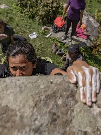 A duplicate of 77, this perspective emphasizes the climber's focus and the essential role of chalk for grip and confidence.