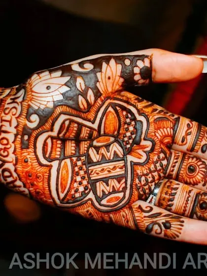 A traditional doli (palanquin) motif, symbolizing the bride's journey to her new home. This is a very popular and meaningful element in bridal mehndi.