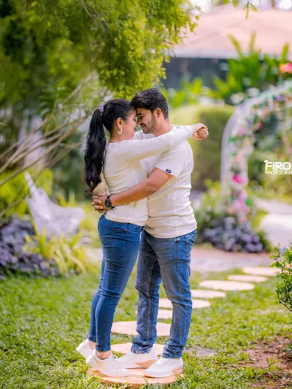 A simple, intimate, and heartfelt embrace. Dressed in matching white tops and jeans, this portrait is all about the pure, unscripted connection between the couple.