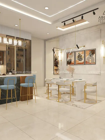 An open-plan kitchen and dining area designed for modern living. The blue bar stools add a vibrant touch to the neutral color scheme, while the gold accents provide a hint of luxury.